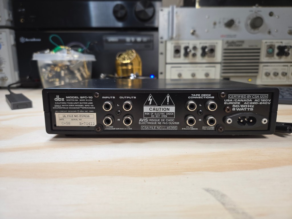 DBX equalizer rear view showing connections; input/output on the left and tape loop connections on the right