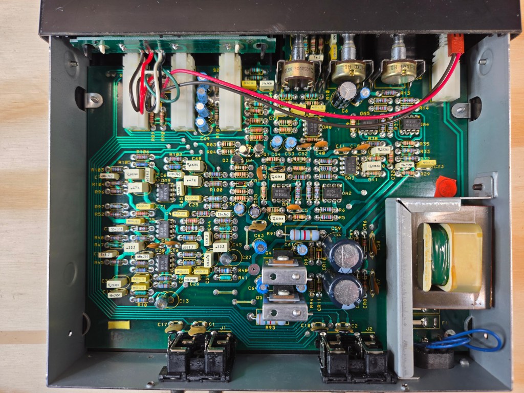 A top-down interior view of the upper side of the circuit board inside the EQ
