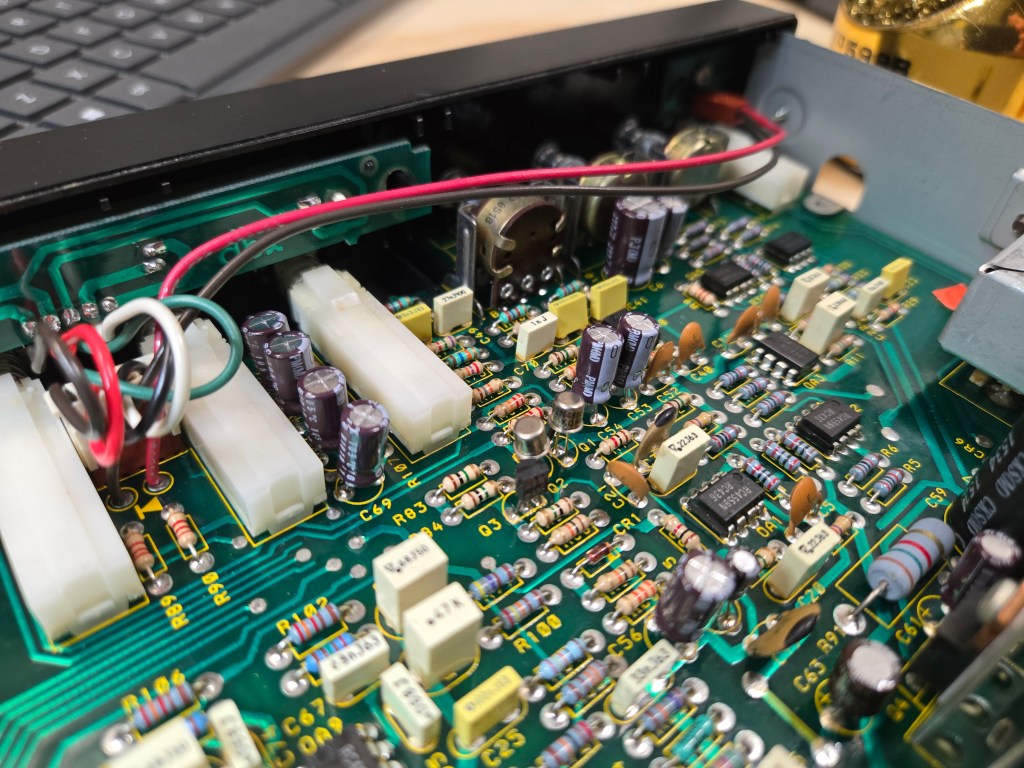 An angled view of the equalizer circuit board, showing several new Nichicon capacitors have been installed.