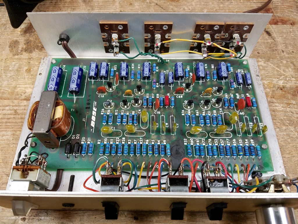 An interior view of a Series 1 mass production equalizer with all components replaced, arranged neatly in rows.