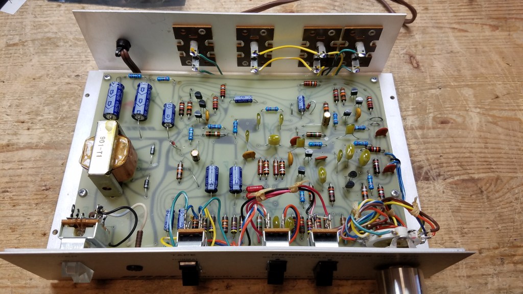 The interior of a Series 1 Early Production equalizer, showing replaced componnets including capacitors and semiconductors.
