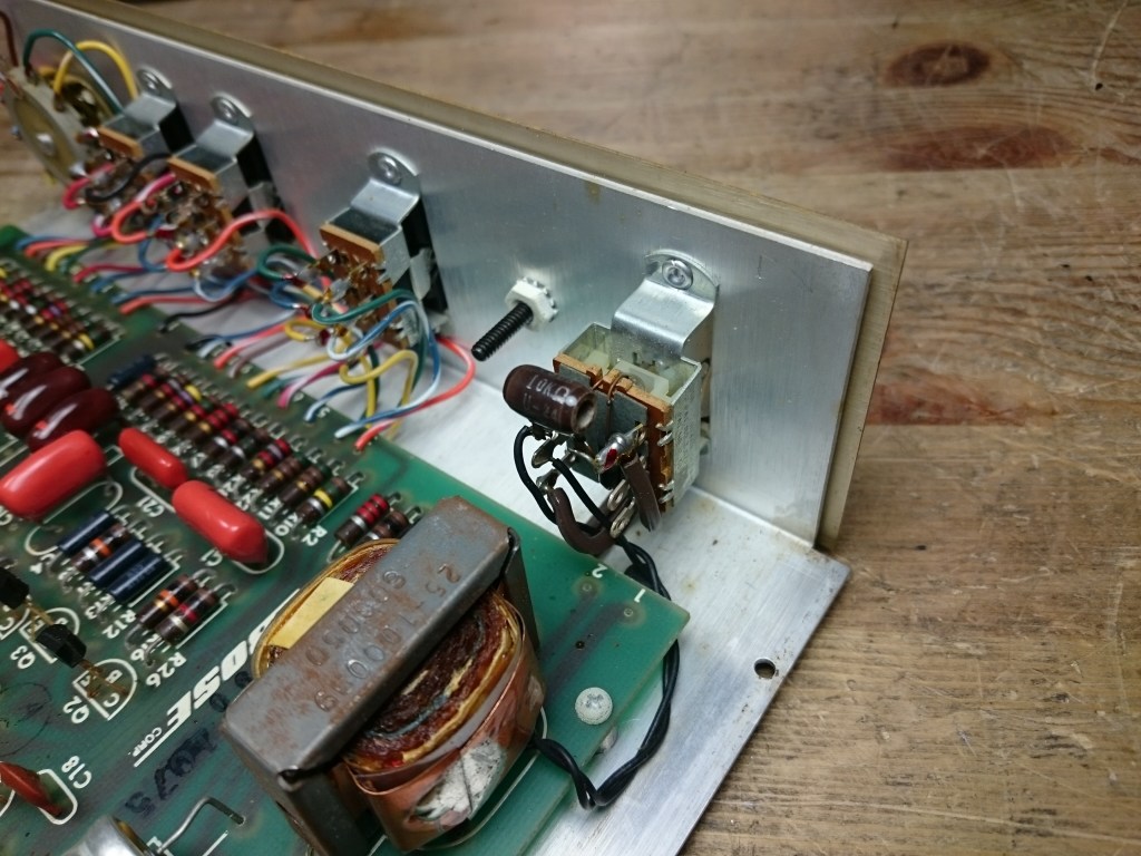 A view of the rear of the power switch inside the equalizer, showing a 10K Ohm 5W resistor used to run the unit on 240V power.