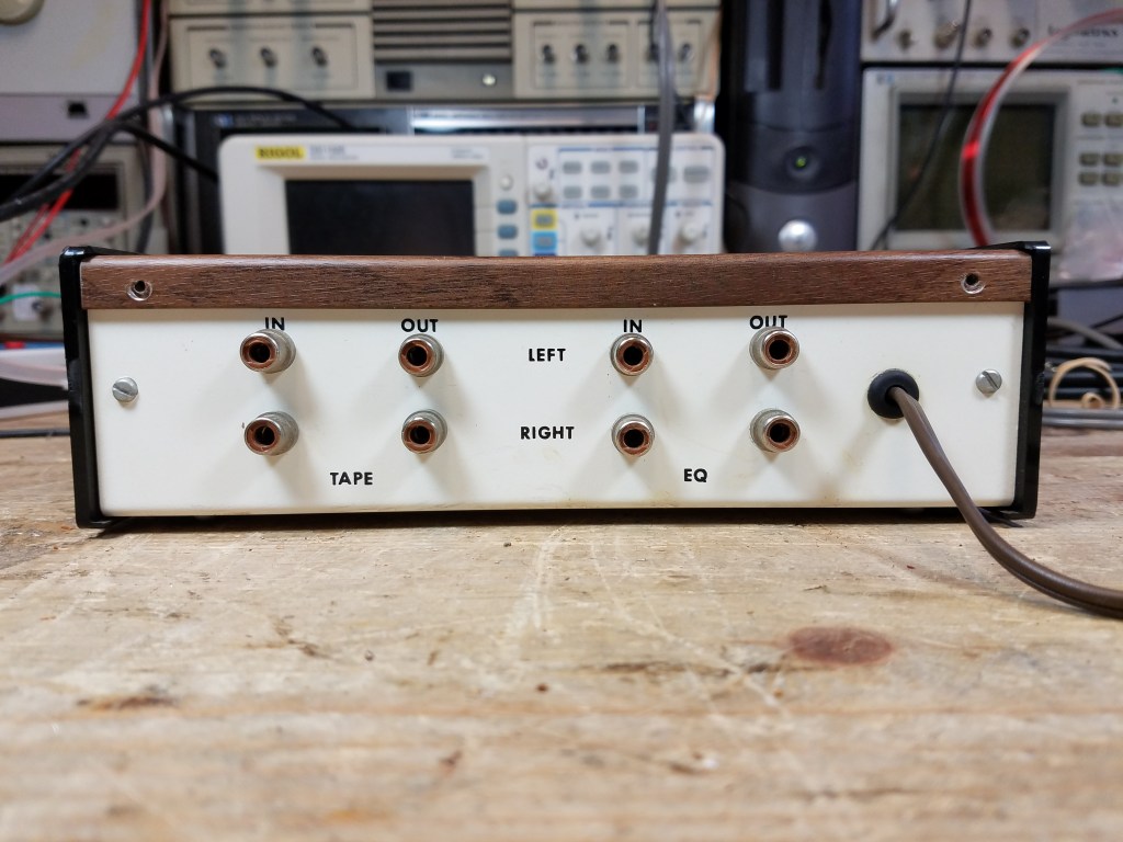 The rough rear panel of the homebrew Series 1 equalizer showing input and output jacks and a few miscellaneous screws.