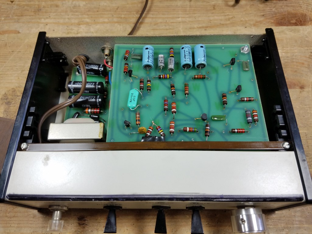 The interior of the homebrew Series 1 equalizer showing a partial view of two out of three circuit boards on their original components.
