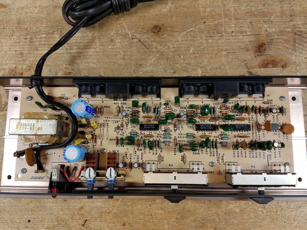 Top down interior view of the 901 Series V Active Equalizer on the repair bench showing original components.